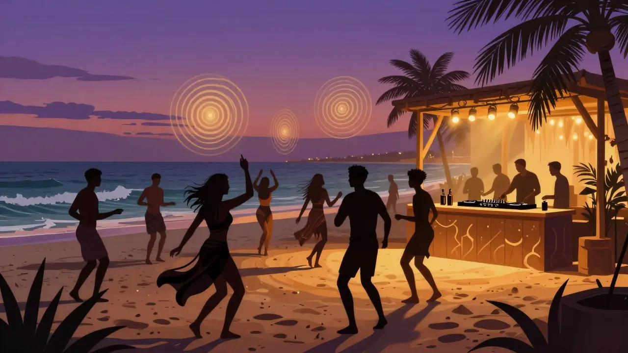 Silhouettes of dancers at a Dubai beach club as the sun sets over the ocean, waves rolling nearby.